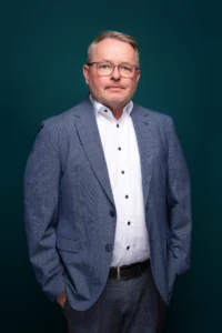 Man in suit against dark background