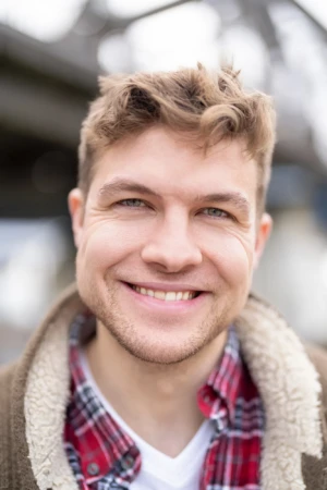 Young man in casual outdoor setting.